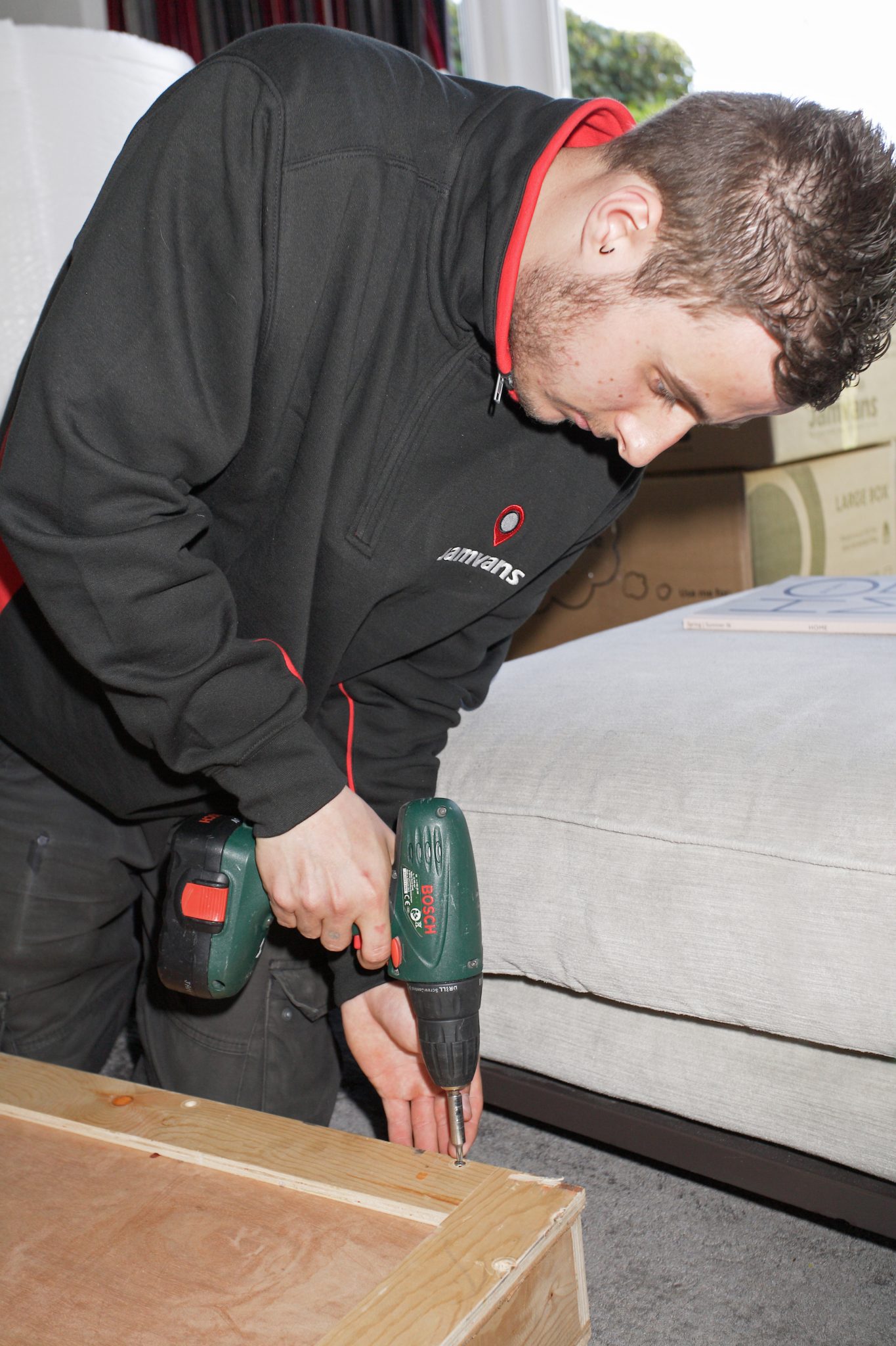 Man drilling furniture