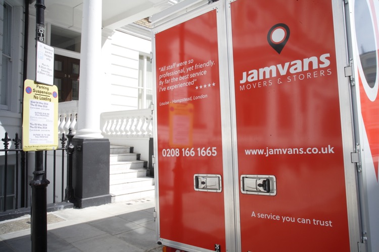 Removals man packing away a TV